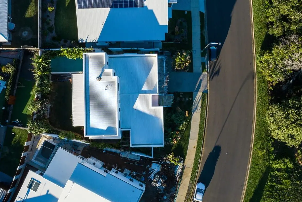 Aerial view of the house and pool from directly above