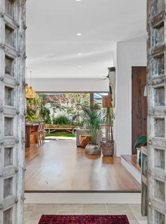 Carved timber doors opening into the living area