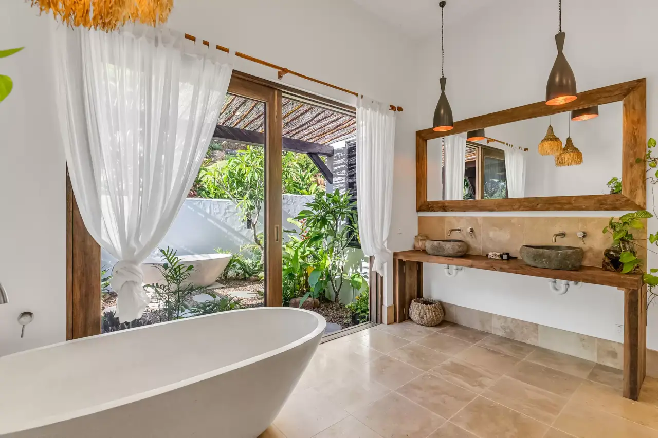 Bathroom with a freestanding bath and timber vanity