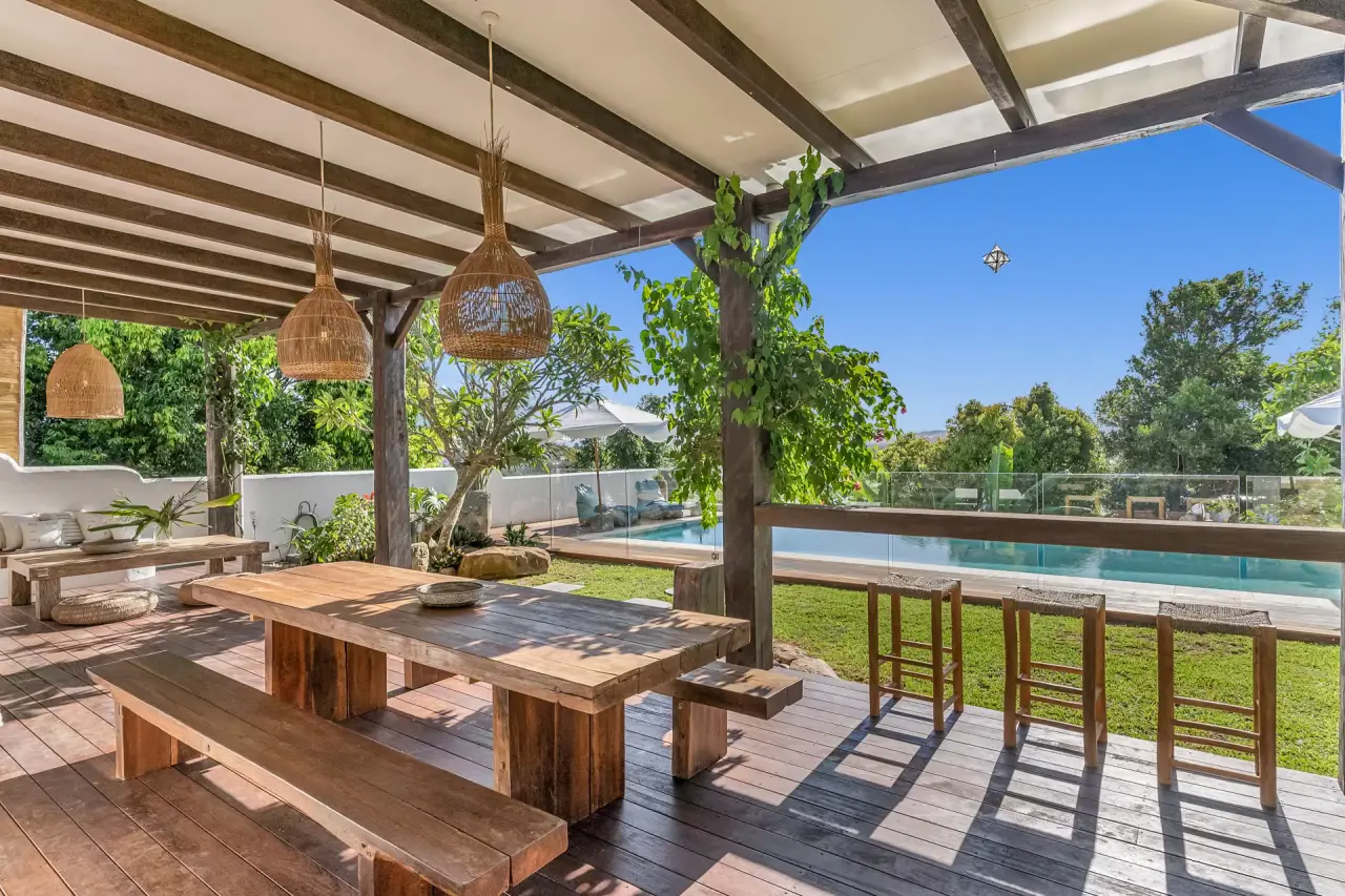 Outdoor dining deck beside the pool
