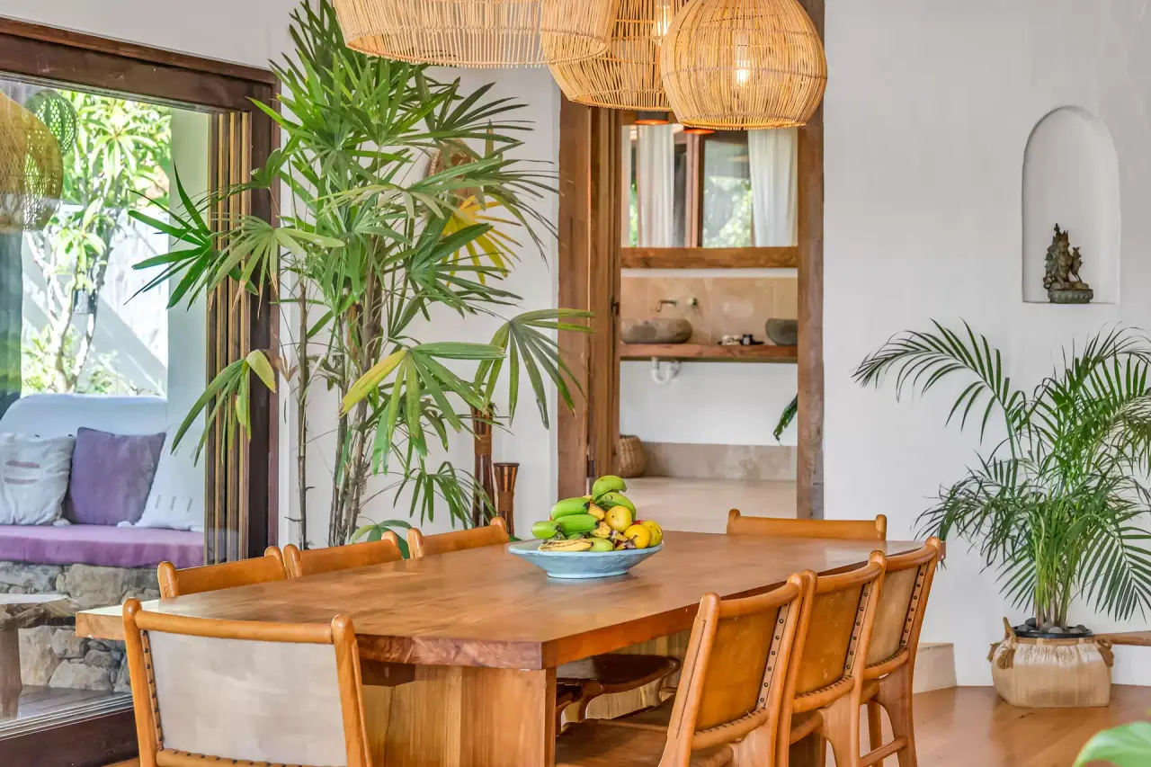 Dining table under rattan pendants
